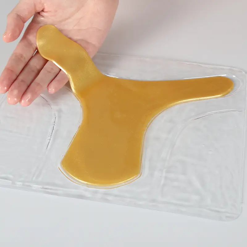 calla-vajacial-mask-soft-hydrogel-peel Golden vajacial hydrogel mask being lifted gently from tray