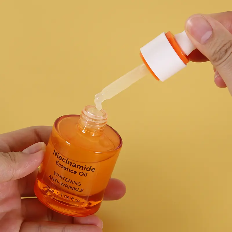 niacinamide-serum-dropper-open-bottle Opened Niacinamide essence oil with dropper dispensing product