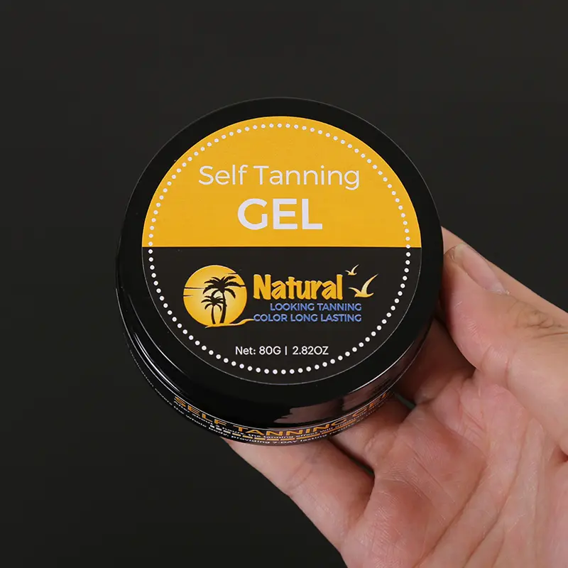 sunless-tanner-gel-handheld Hand holding CALLA sunless tanner gel jar in yellow and black design for private label tanning gel manufacturers